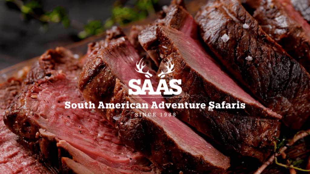 Venison on grill with South American Adventure Safari Logo-min